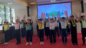 Students performing a song during an overseas cultural exchange programme.