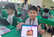 Student displaying a Chinese language learning activity on a tablet.