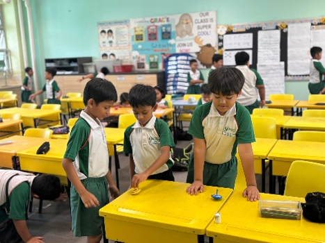 Students taking part in a hands-on learning activity in the classroom.